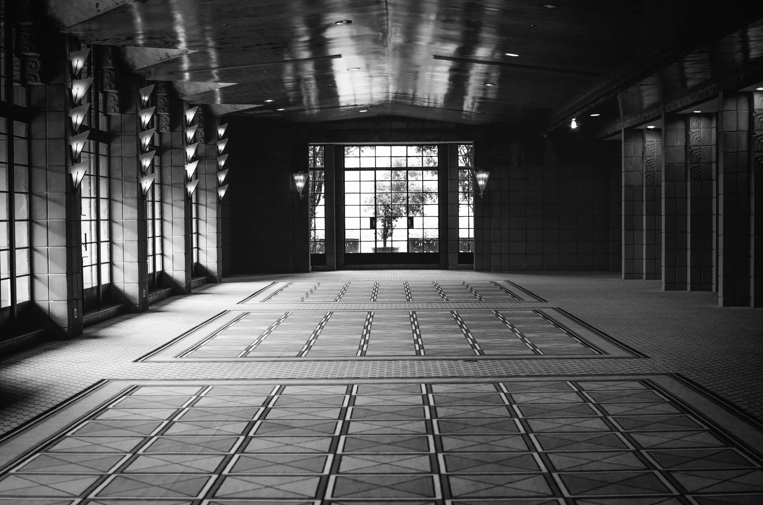 Black and white view down a geometric colonnade at the Arizona Biltmore