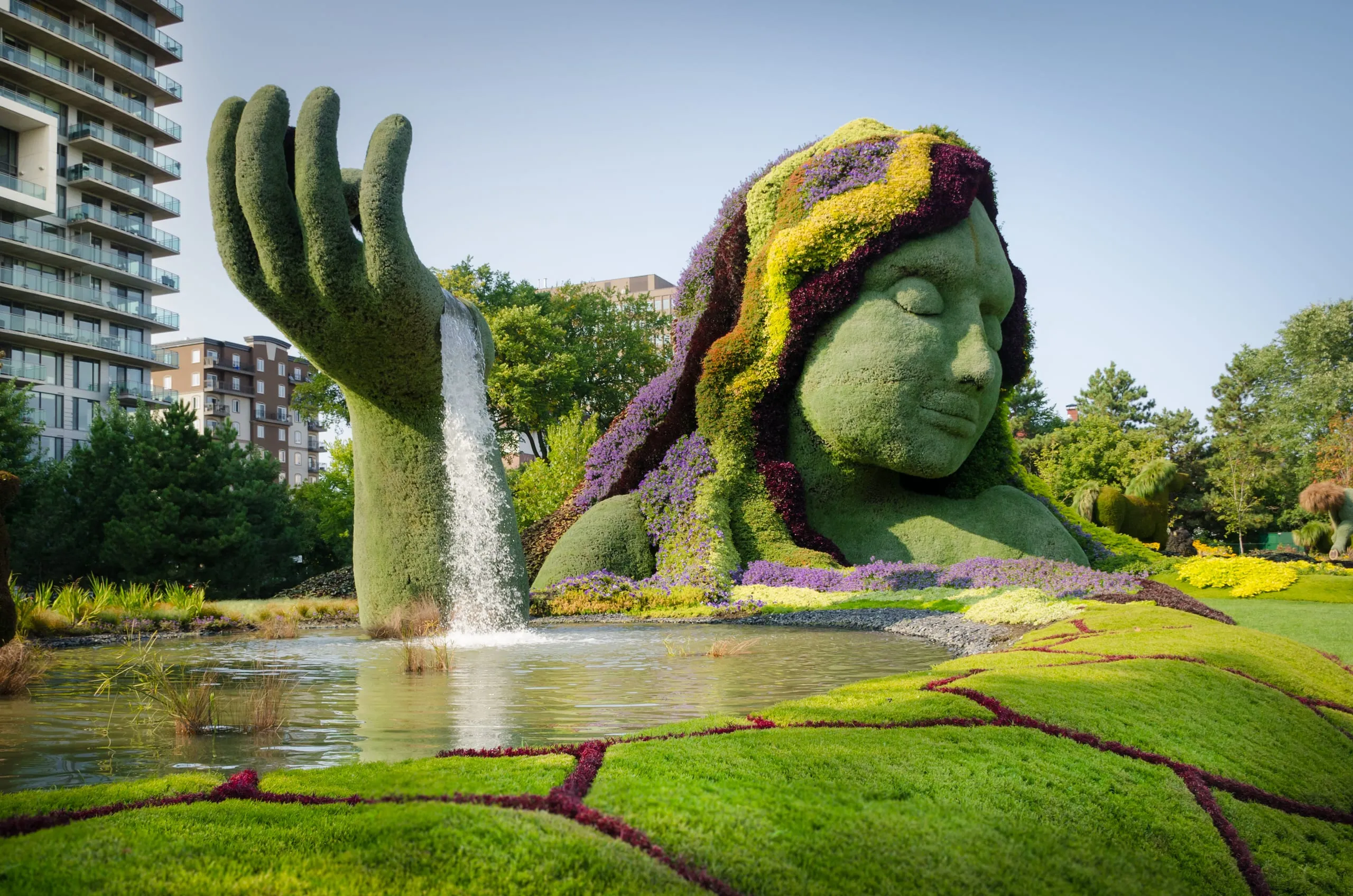 Giant living topiary sculpture of a reclining figure at Mosaïculture, near Ottawa