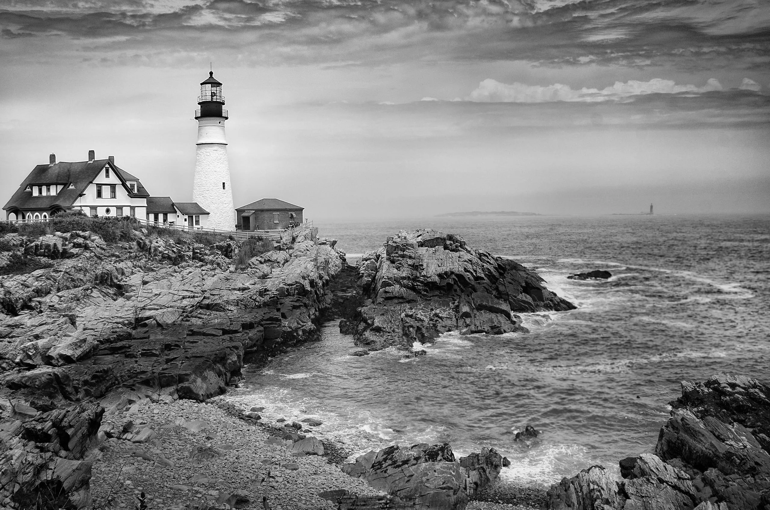 Black and white study of Portland Head Light and its keeper's house, Maine